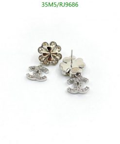 Flower and CC logo stud earrings.