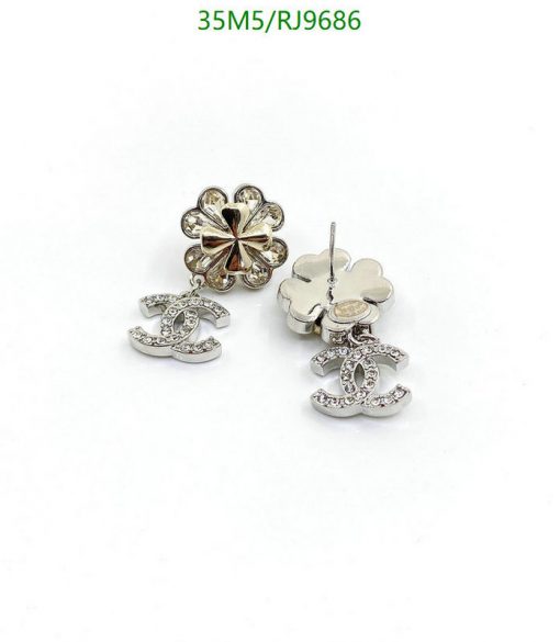 Flower and CC logo stud earrings.