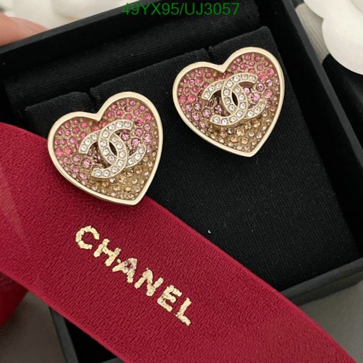 Heart-shaped earrings with jewels in a box.