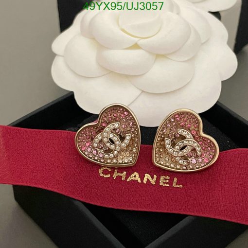 Heart-shaped earrings with gemstones on branded ribbon.