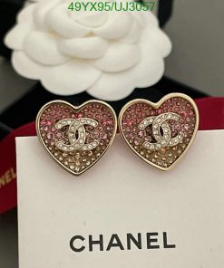 Designer heart-shaped sparkling earrings on display.