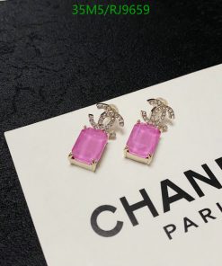 Elegant pink gemstone earrings on branded card.