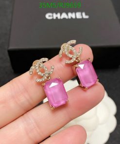 Elegant pink crystal earrings with jeweled logos.