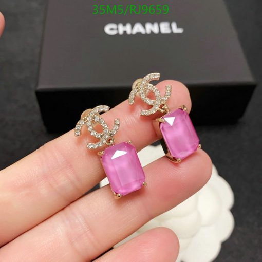 Elegant pink crystal earrings with jeweled logos.