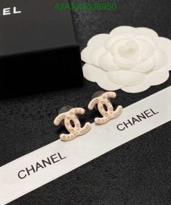 Designer logo earrings with packaging and decoration.