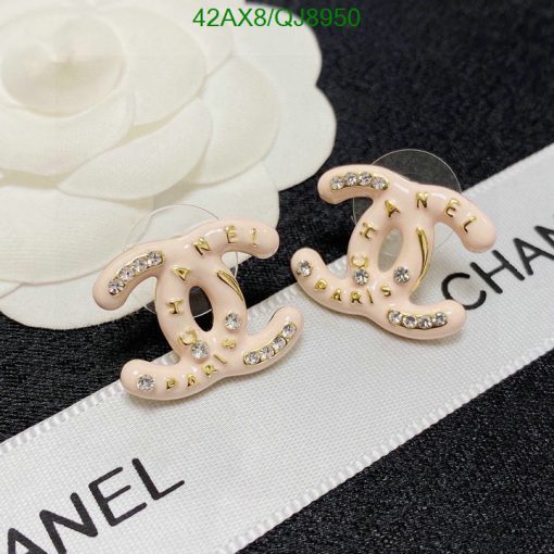 Designer logo earrings with rhinestone accents on label.