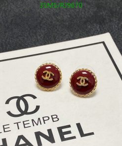 Designer logo earrings with packaging.