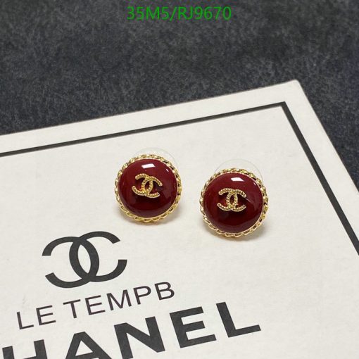 Designer logo earrings with packaging.