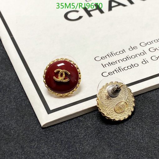 Designer button-style earrings on certificate.