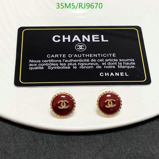 Chanel authenticity card with logo earrings on white background.