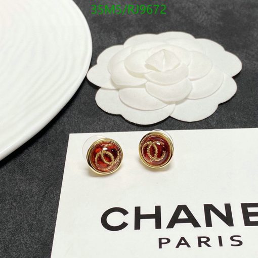 Chanel earrings and logo with a white camellia-shaped decoration.