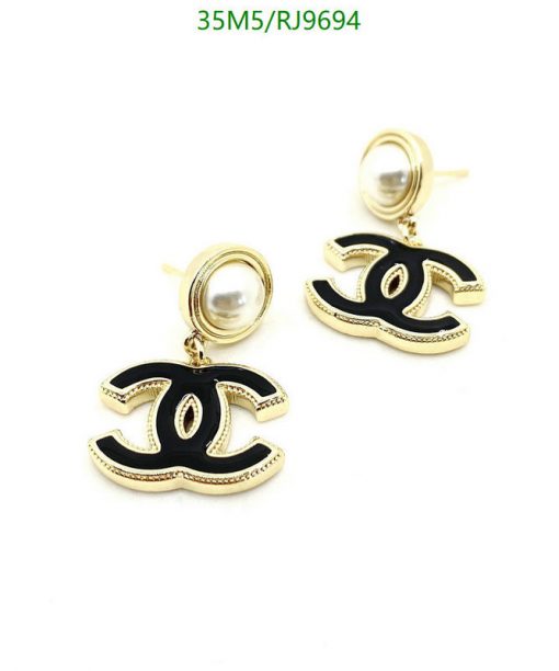 Gold-tone black enamel designer-style dangle earrings.