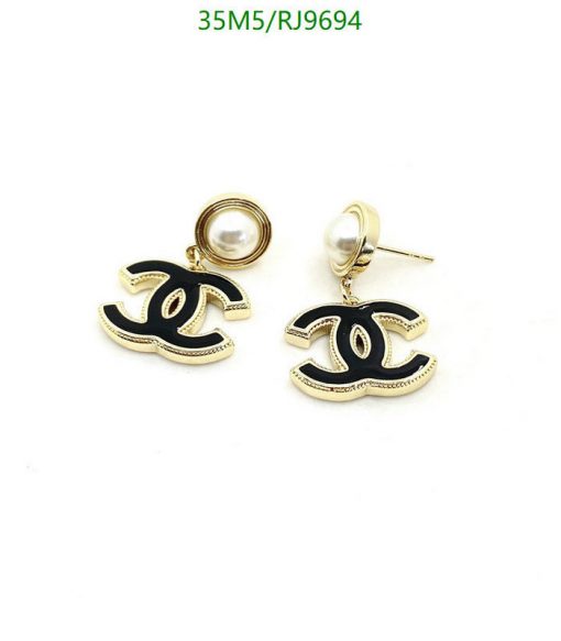 Gold pearl designer logo earrings.