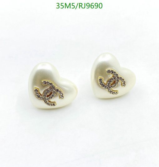 Pearl heart-shaped earrings with embellished logo design.