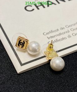 Pearl earrings on certification document.