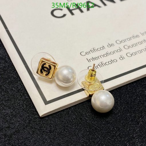 Pearl earrings on certification document.