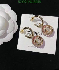 Designer logo earrings with glitter detail on card.