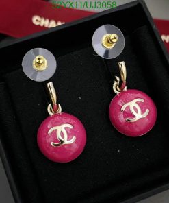 Designer pink drop earrings in box.