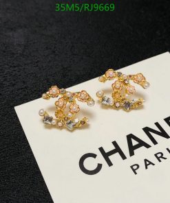 Elegant floral-themed earrings with pearls and crystals.