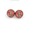 Designer-style pink and gold button earrings.