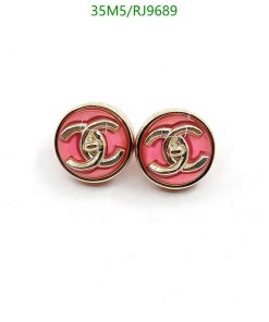 Designer-style pink and gold button earrings.