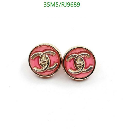 Designer-style pink and gold button earrings.