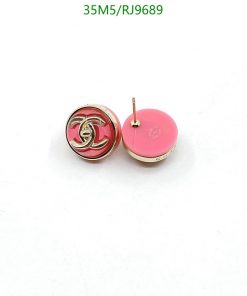 Designer pink logo stud earrings on white background.