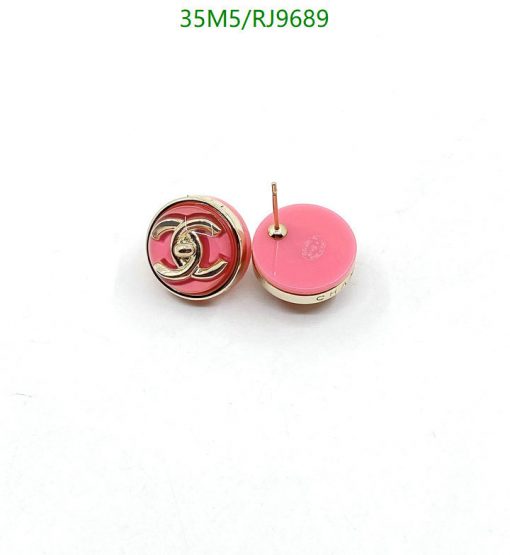 Designer pink logo stud earrings on white background.