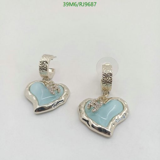 Silver heart-shaped earrings with blue enamel.