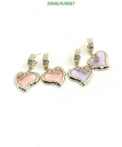 Heart-shaped enamel earrings with decorative accents.