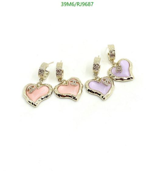 Heart-shaped enamel earrings with decorative accents.