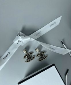 Designer earrings with ribbon and box.