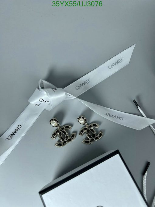 Designer earrings with ribbon and box.