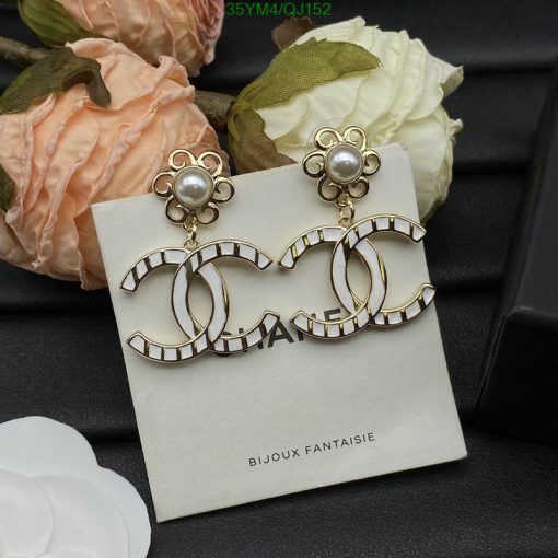 Pearl accent fashion earrings with floral design.