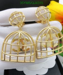 Gold birdcage-style dangle earrings.