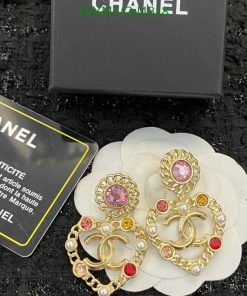 Chanel earrings with gemstones and packaging.