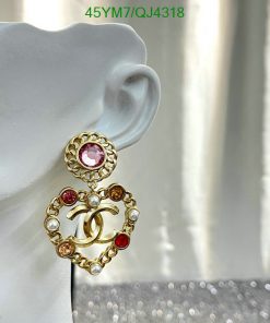 Gold heart-shaped earring with pearls and gems.