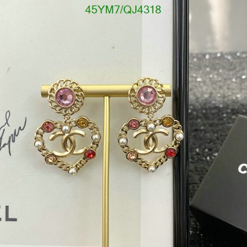 Gold heart-shaped earrings with pearls and pink stones.