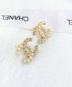 Pearl and crystal gold-tone earrings.