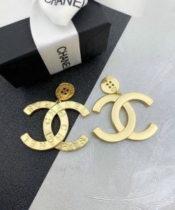 Designer logo earrings and packaging.