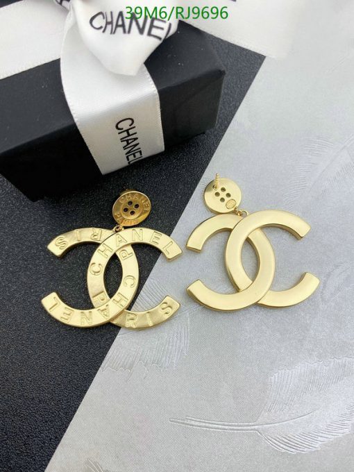 Designer logo earrings and packaging.