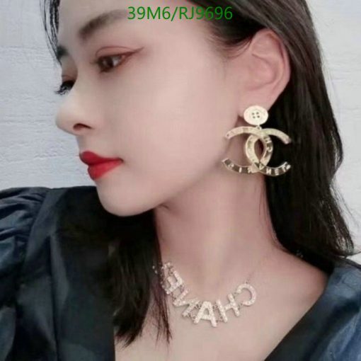 Woman with statement earrings and necklace.