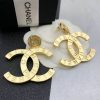 Chanel gold-tone logo earrings with box.