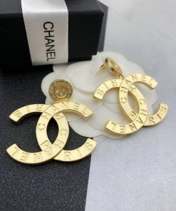 Chanel gold-tone logo earrings with box.