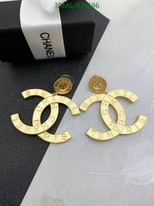 Designer gold-tone logo earrings with packaging.