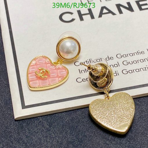 Designer heart-shaped earrings with pearl detail.