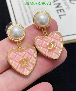 Elegant pink heart-shaped designer earrings with pearls.