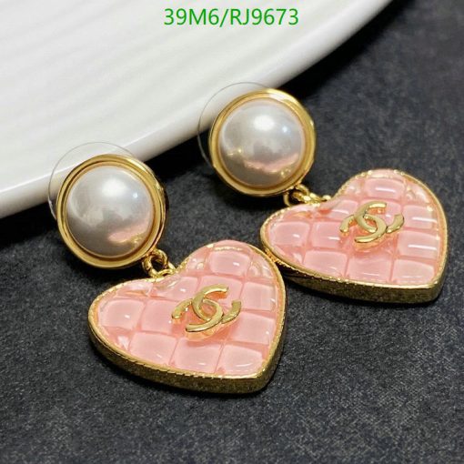 Elegant pearl and heart-shaped drop earrings.