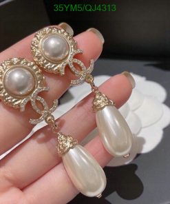 Elegant pearl drop earrings with gold accents.