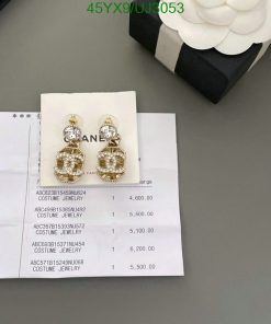 Earrings on receipt with prices beside a gift box.